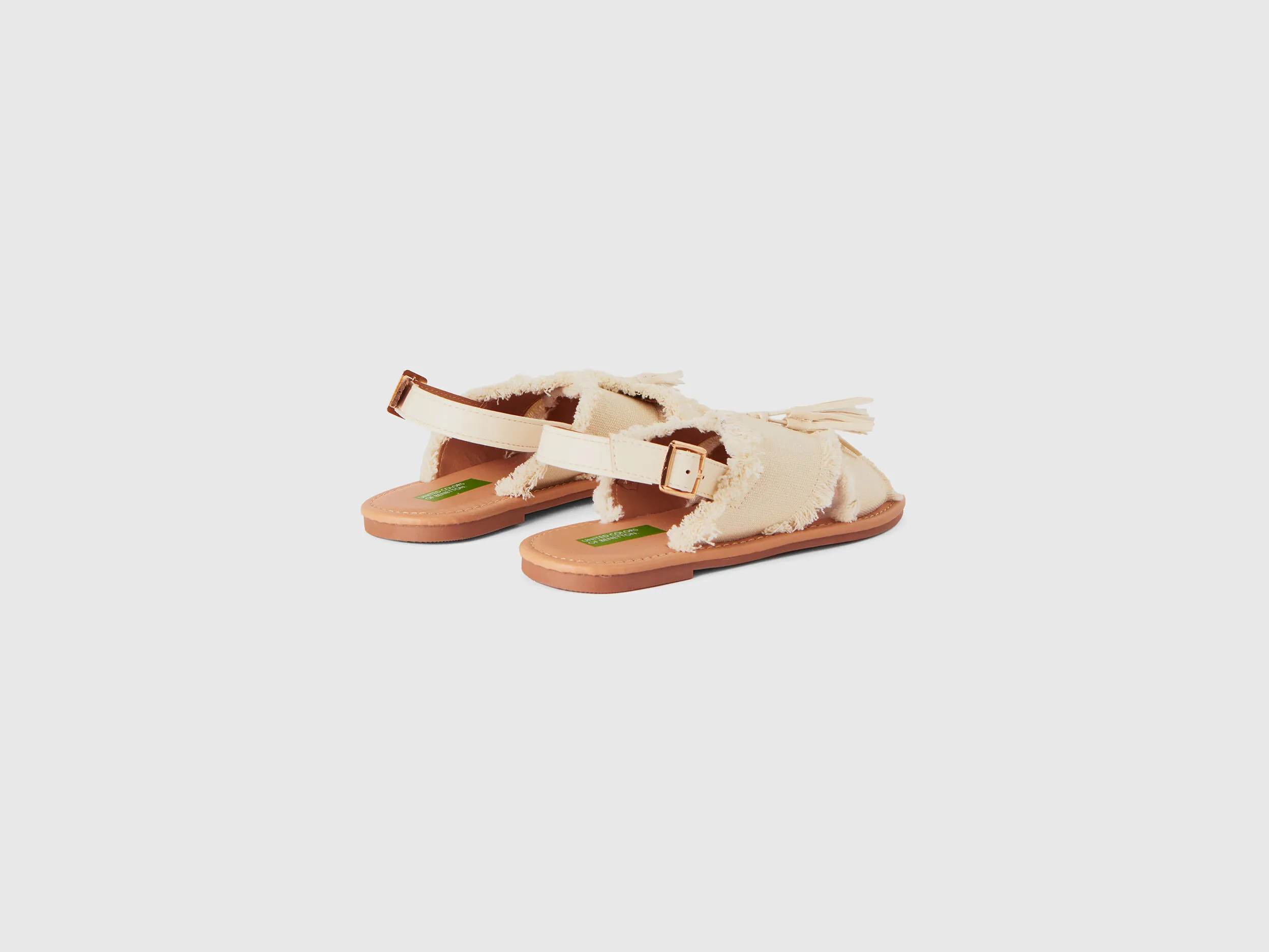 Flat sandals with tassels - Creamy White | Benetton